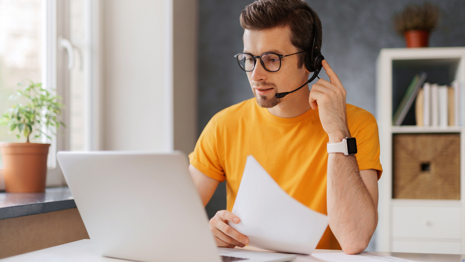 Young man using UCaas doing remote work