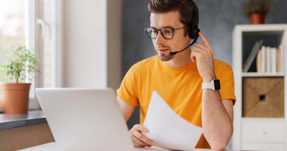 Young man using UCaas doing remote work